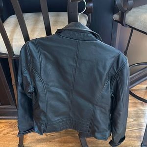 Size 6 black jacket. 100% Polyurethane. Worn only a few times.